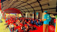 Peserta Jambore Nasional XII 2026 mengikuti sesi interaktif PBB di Global Development Village, Buperta Cibubur, yang mengajak anggota Pramuka muda memahami Tujuan Pembangunan Berkelanjutan (SDGs) melalui kegiatan partisipatif dan diskusi. Foto: Talitha Vanya/UNIC